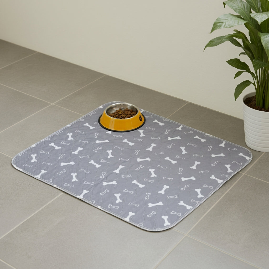 Grey reusable pet mat beneath dog bowls
